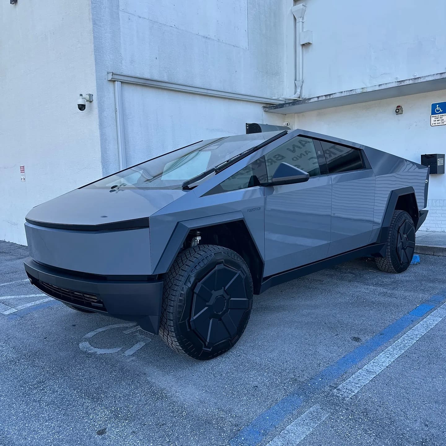Tesla Cybertruck wrapped by Wrap Trap, front three-quarter view outside the Hollywood FL shop