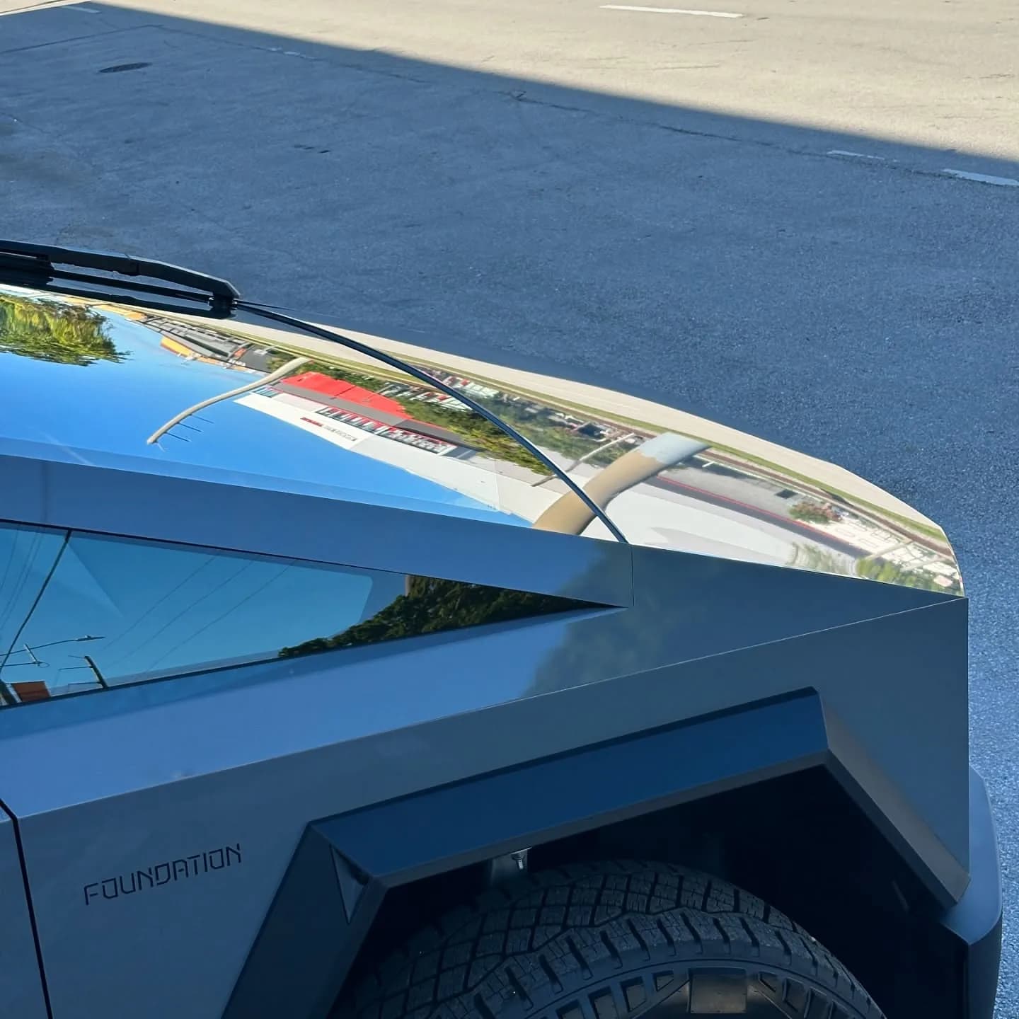 Close-up of a wrapped Cybertruck hood with the Foundation Series badge